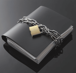 Counselling and the Law - a black file book bound in chains and a padlock to communicate confidentiality