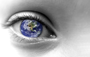 Humanism approach to counselling - a closeup of an eye with the world as the iris
